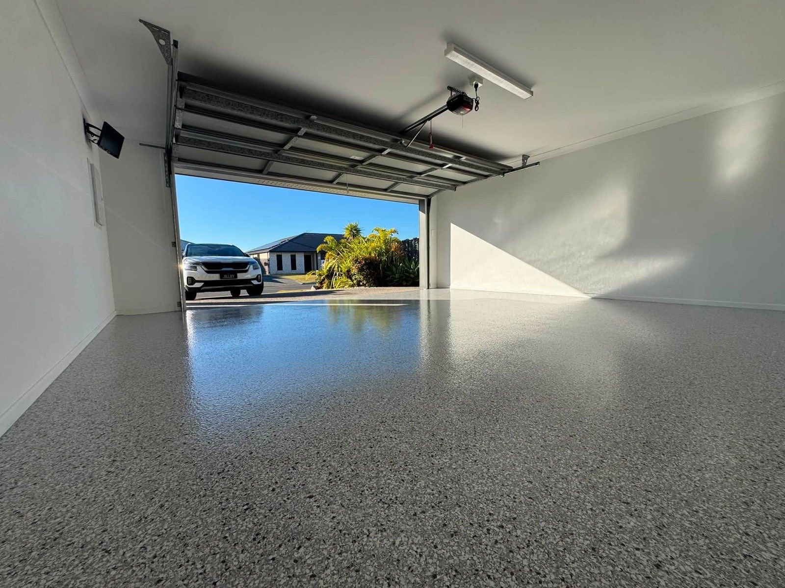 Grey flake epoxy floor in a double garage