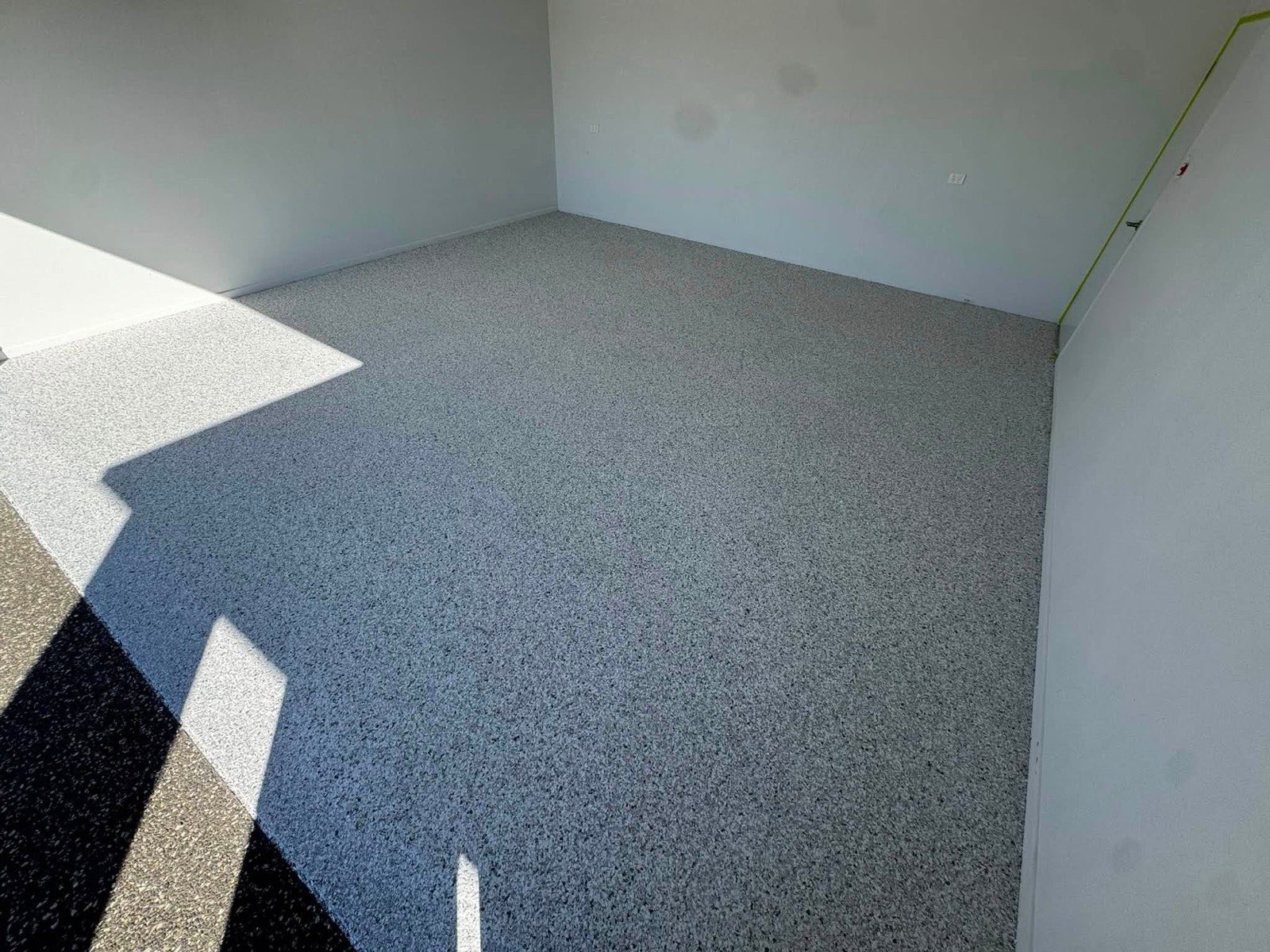 The same slab after preparation and a grey flake epoxy coating